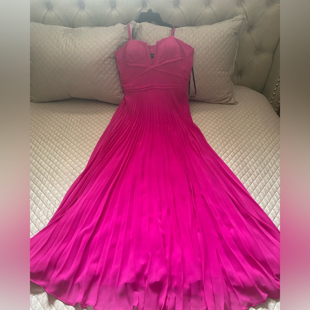Bright fuscia gown with corset top and adjustable straps, was worm once